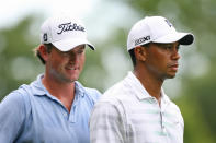 Webb Simpson (L) and Tiger Woods walk off the tee box on the sixth hole during the first round of the Greenbrier Classic at the Old White TPC on July 5, 2012 in White Sulphur Springs, West Virginia. (Photo by Hunter Martin/Getty Images)