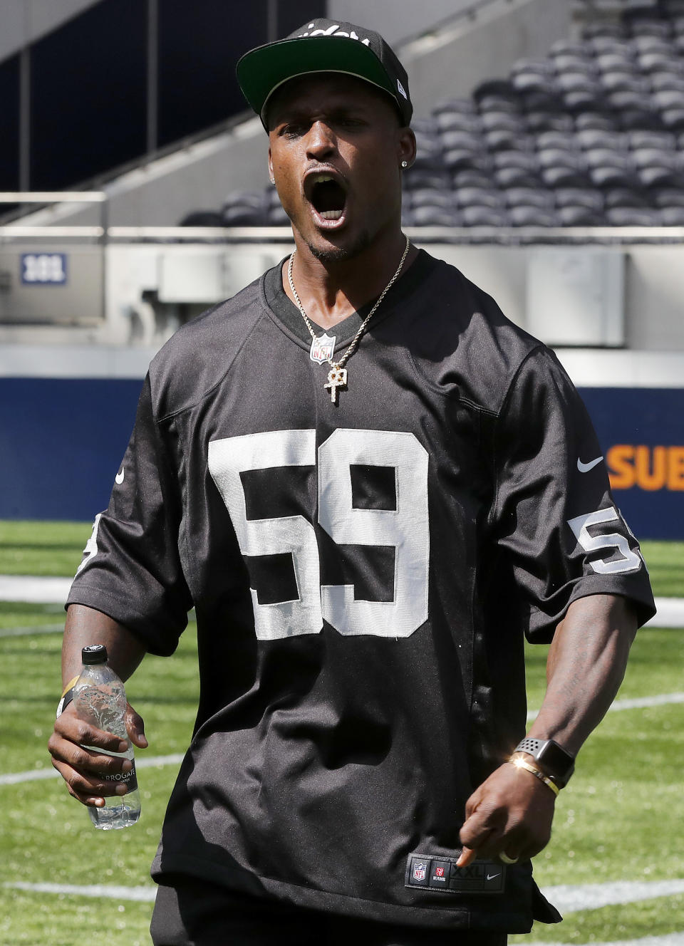 NFL player Tahir Whitehead reacts as he coaches a young team during the final tournament for the UK's NFL Flag Championship, featuring qualifying teams from around the country, at the Tottenham Hotspur Stadium in London, Wednesday, July 3, 2019. The new stadium will host its first two NFL London Games later this year when the Chicago Bears face the Oakland Raiders and the Carolina Panthers take on the Tampa Bay Buccaneers. (AP Photo/Frank Augstein)