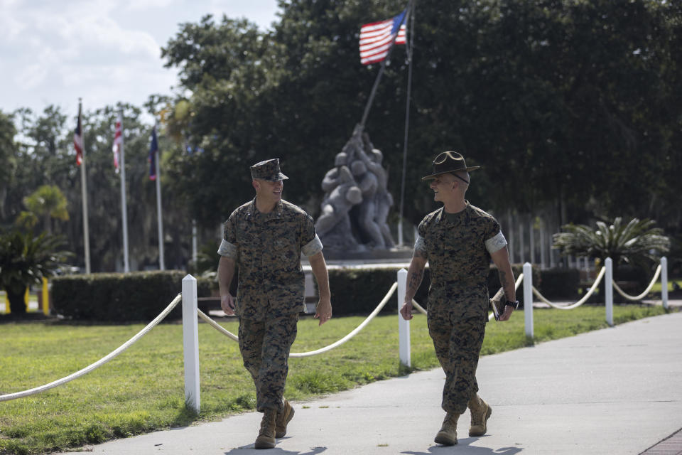 U.S. Marine Brig. Gen. Walker Field, left, walks with Sgt. Maj. Sael Garcia near the Iwo Jima monument at the Marine Corps Recruit Depot, Wednesday, June 28, 2023, in Parris Island, S.C. (AP Photo/Stephen B. Morton)