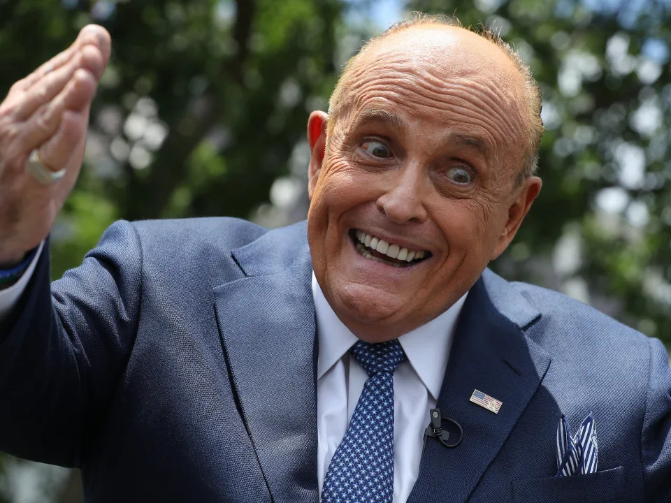 Rudy Giuliani speaks to reporters