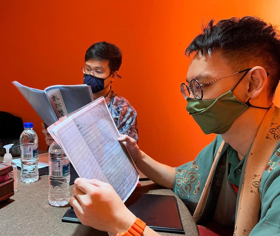 Reading scripts at the Loading scripted murder mystery game studio in Singapore. (Photo: Bryan Tan)