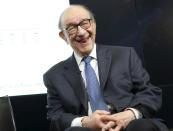 FILE PHOTO: Former Federal Reserve Chair Alan Greenspan smiles at a Brookings Institution forum