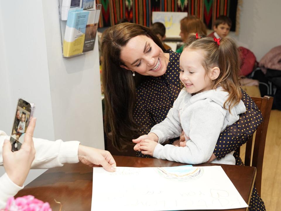 reading, england   november 17  catherine, princess of wales poses for a picture taken with zlata yeromenko, aged 5, as she visits the reading ukrainian community centre on november 17, 2022 in reading, england photo by paul edwards   wpa poolgetty images