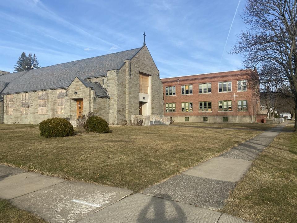 The old St. Vincent de Paul Church and the nearby elementary school building are part of the plan to revitalize the campus with 45 apartment units and a daycare.