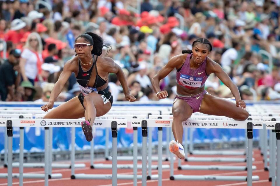 Former University of Kentucky standout Masai Russell, right, won the 100-meter hurdles at the U.S. Olympic Track and Field Trials on Sunday in a world-leading time of 12.25 seconds.