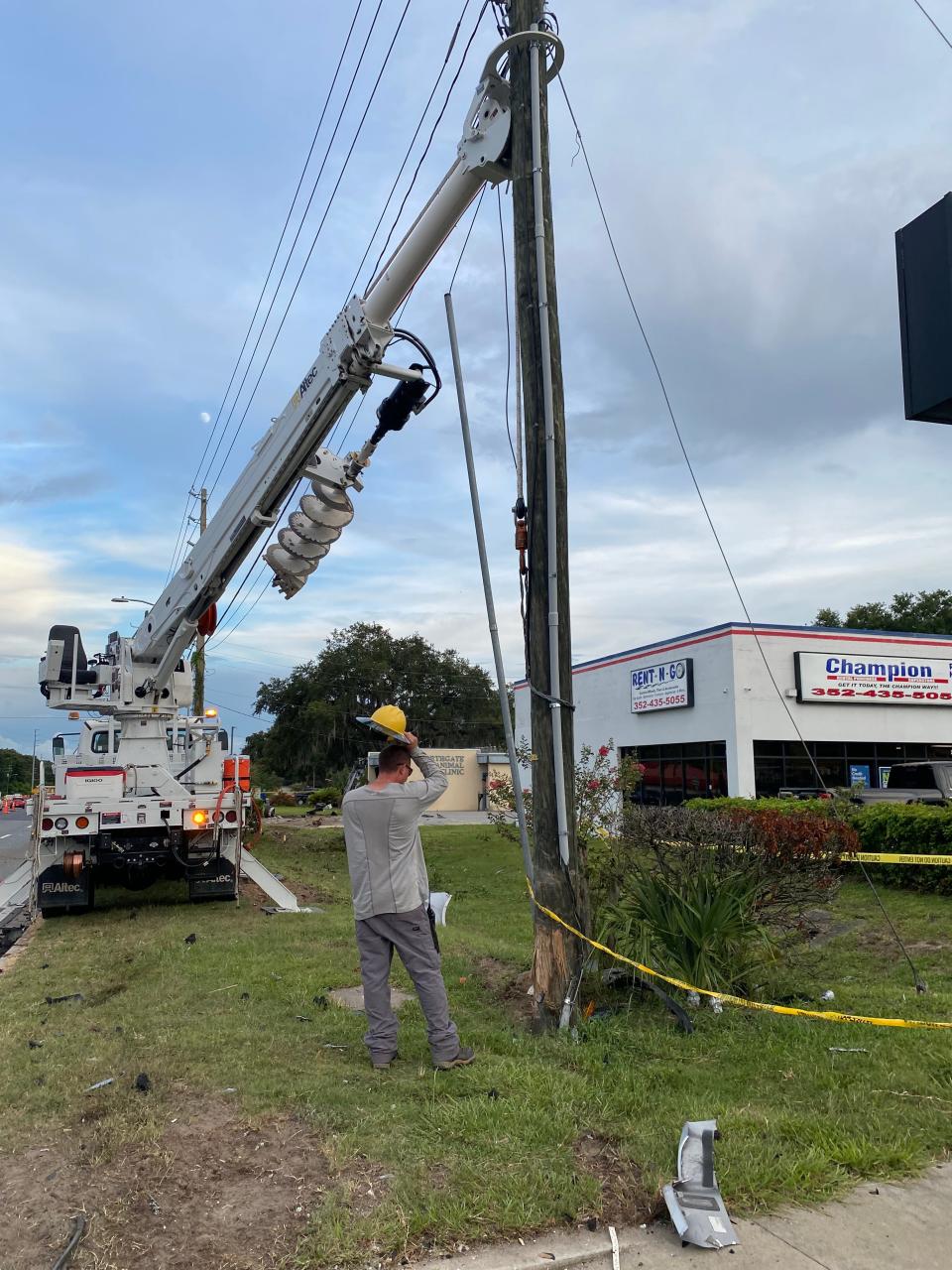 A Jaguar estimated to be traveling more than 100 mph slammed into a Cadillac Escalade at the intersection of Martin Luther King Drive and U.S. Highway 441/27 Monday evening, causing an explosion of car parts and the speeding car to flip onto the side of a building several feet away. The car also broke a wooden power pole.