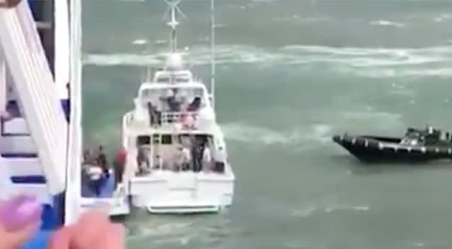 The passengers were escorted from the ship. Source: 7 News