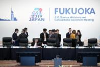 Bank of Japan Governor Haruhiko Kuroda and other participants prepare to attend the G20 finance ministers and central bank governors meeting, in Fukuoka