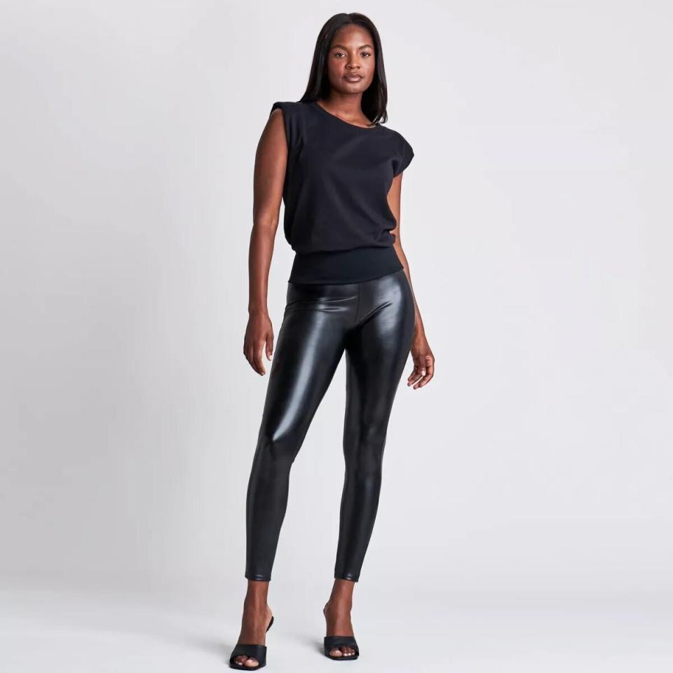 Model wearing faux leather leggings