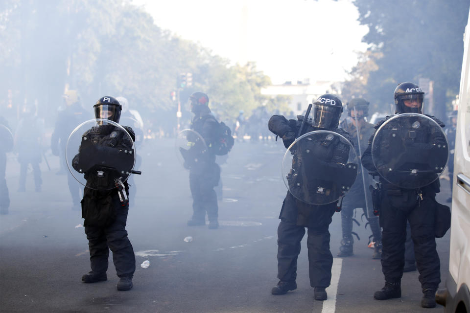 Police clear demonstrators from Lafayette Park as they protest the death of George Floyd, Monday, June 1, 2020, in Washington. Floyd died after being restrained by Minneapolis police officers. (AP Photo/Alex Brandon)