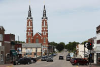 Traffic is seen on main street in Dyersville, Iowa, home to the Field of Dreams movie site, Friday, June 5, 2020. Major League Baseball is building another field a few hundred yards down a corn-lined path from the famous movie site in eastern Iowa but unlike the original, it's unclear whether teams will show up for a game this time as the league and its players struggle to agree on plans for a coronavirus-shortened season. (AP Photo/Charlie Neibergall)