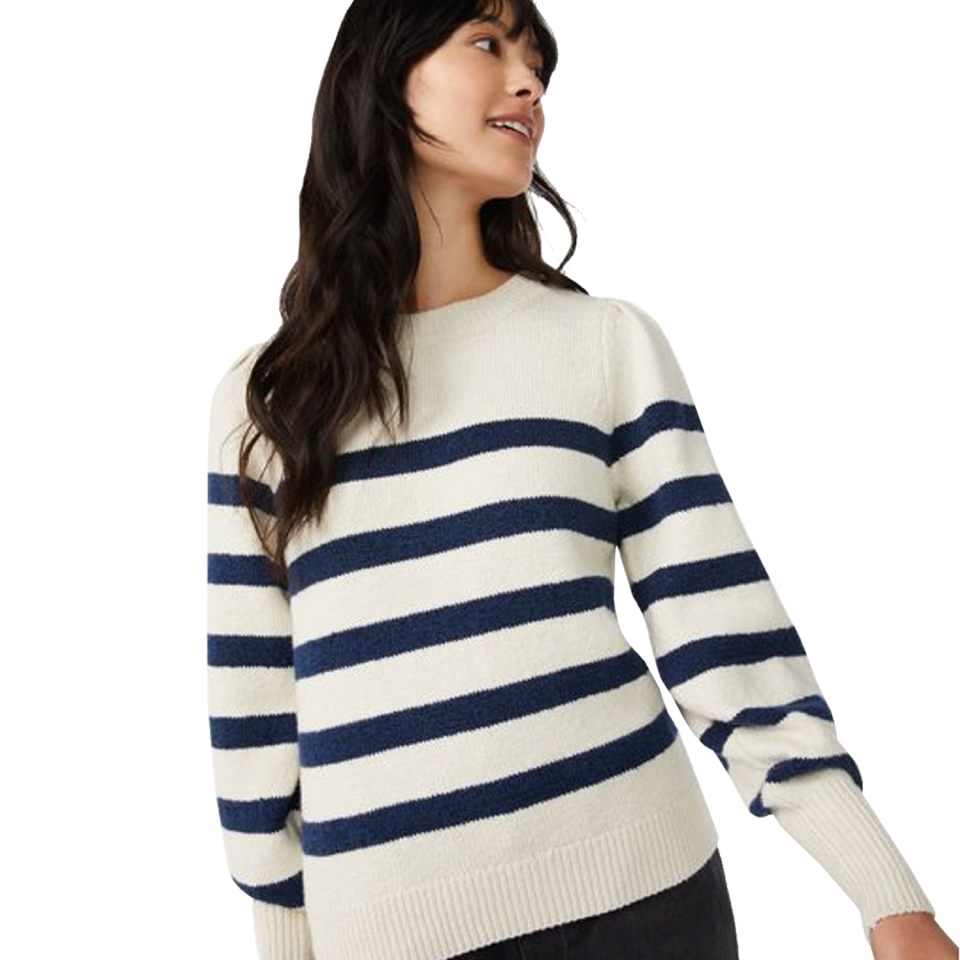 woman wearing white and navy striped sweater