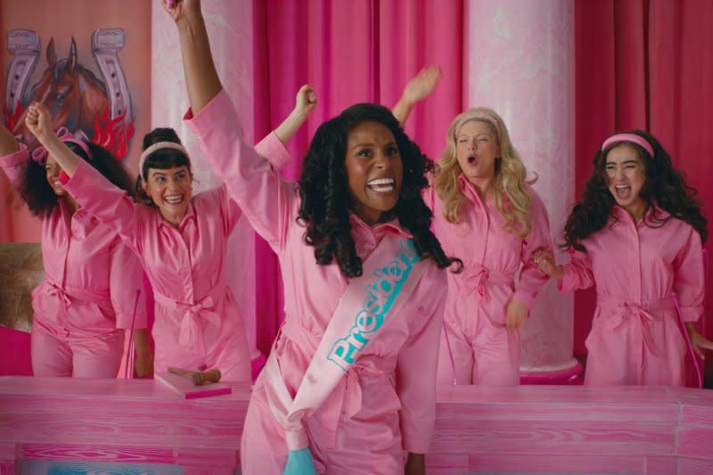 President Barbie (Issa Rae, C) leads a cast of Barbies. Photo courtesy of Warner Bros. Entertainment