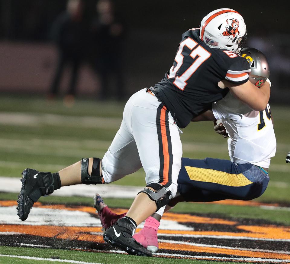 Massillon lineman Jaiden Woods sacks Euclid quarterback Deonte Rucker in the first half at Massillon.