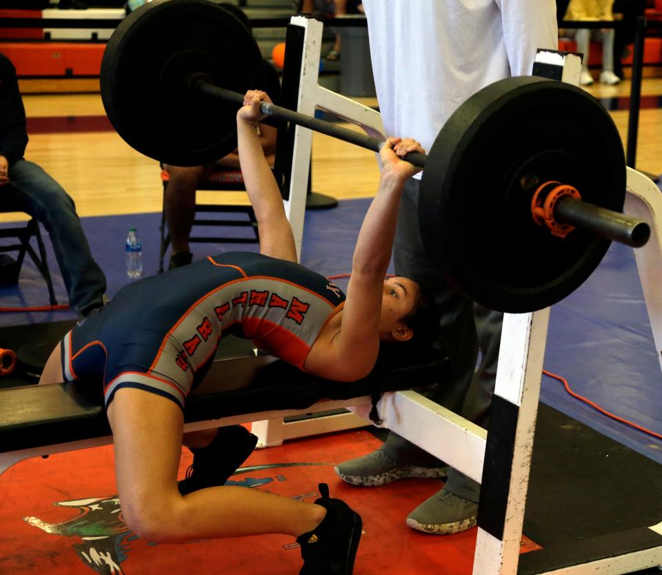 Natalee Brown of Lemon Bay High competes in the bench press at the Class 1A-Region 4 meet Saturday afternoon at Lemon Bay High. Brown won the 139-pound division in both the traditional and the snatch events.