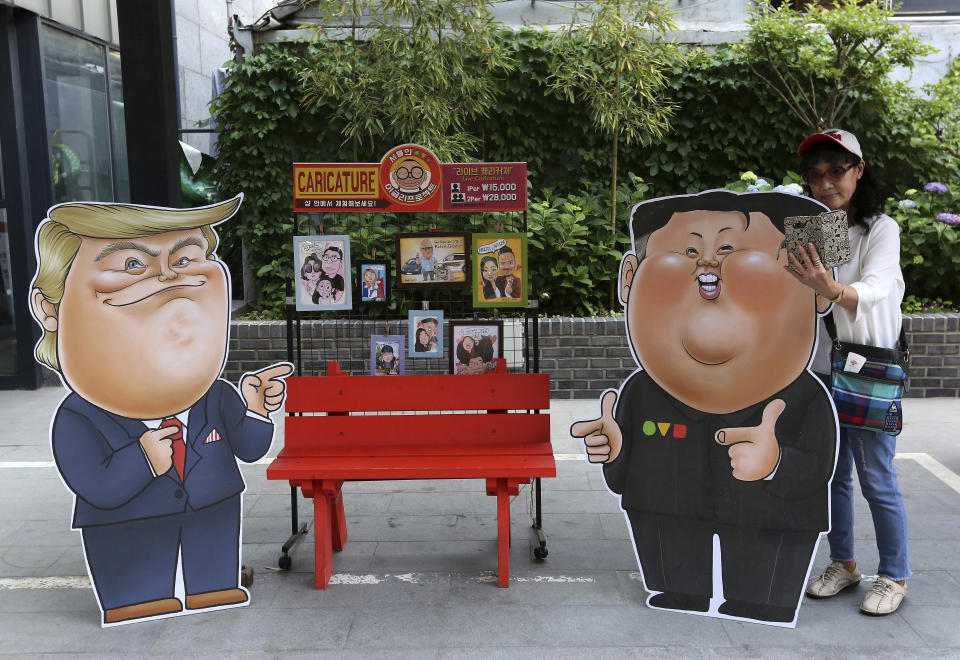 Caricatures depicting U.S. President Donald Trump, left, and North Korean leader Kim Jong Un are displayed in Seoul, South Korea, Sunday, May 26, 2019. In an apparent contradiction of his national security adviser, President Donald Trump on Sunday downplayed recent North Korean missile tests, tweeting from Tokyo that they're not a concern for him in comments sure to unnerve Japanese leaders. (AP Photo/Ahn Young-joon)