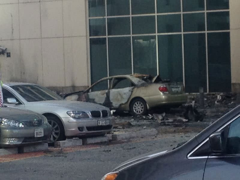 Cars shattered by falling debris.