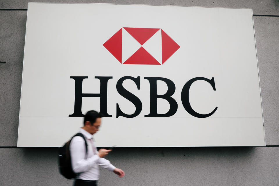 A man walks past a logo of HSBC at its headquarters in Kuala Lumpur, Malaysia August 6, 2019. Picture taken August 6, 2019. REUTERS/Lim Huey Teng