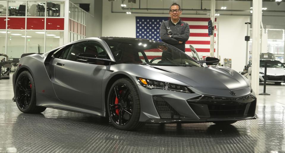 John Ikeda, leader of the Acura product line, poses with one of the last Acura NSX to come off the production line at the  Performance Manufacturing Center near Marysville. It is notable that when asked to pose with the car, Ikeda didn't touch any part of the car except the door handle because it had already been purchased by a customer and he didn't want to risk scratching or damaging the finish.