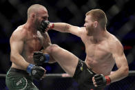 Matt Frevola, right, lands a punch on Lando Vannata during the third round of a lightweight mixed martial arts bout at UFC 230, Saturday, Nov. 3, 2018, at Madison Square Garden in New York. (AP Photo/Julio Cortez)