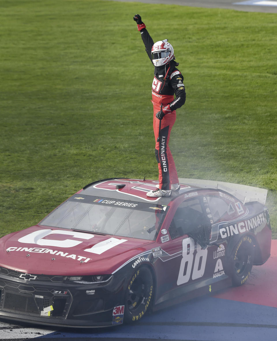 Alex Bowman celebrates on the roof of his race car after winning a NASCAR Cup Series auto race Sunday, March 1, 2020 in Fontana, Calif. (AP Photo/Will Lester)