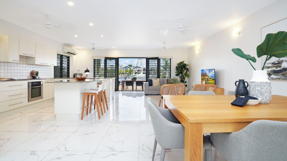 The open plan living, kitchen and dining room of the $1 million property for sale in Darwin.