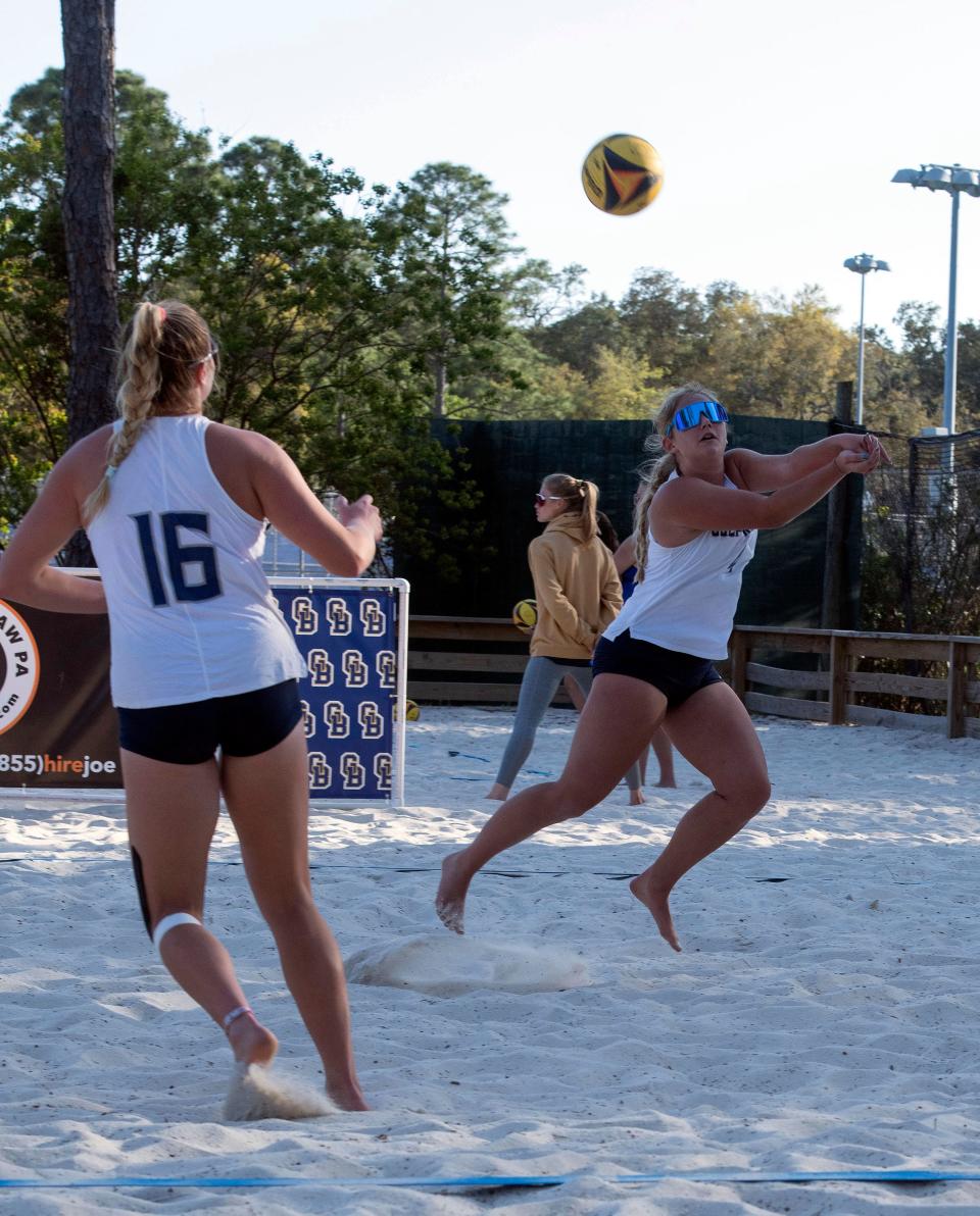 Gulf Breeze's Riley Bloomberg digs a Pace serve during beach volleyball action at the Gulf Breeze Community Center on Friday, April 5, 2024.