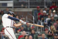 Atlanta Braves Matt Olson hits a home run in the sixth inning of a baseball against the New York Mets, Sunday, Oct. 2, 2022, in Atlanta. (AP Photo/Hakim Wright Sr.)