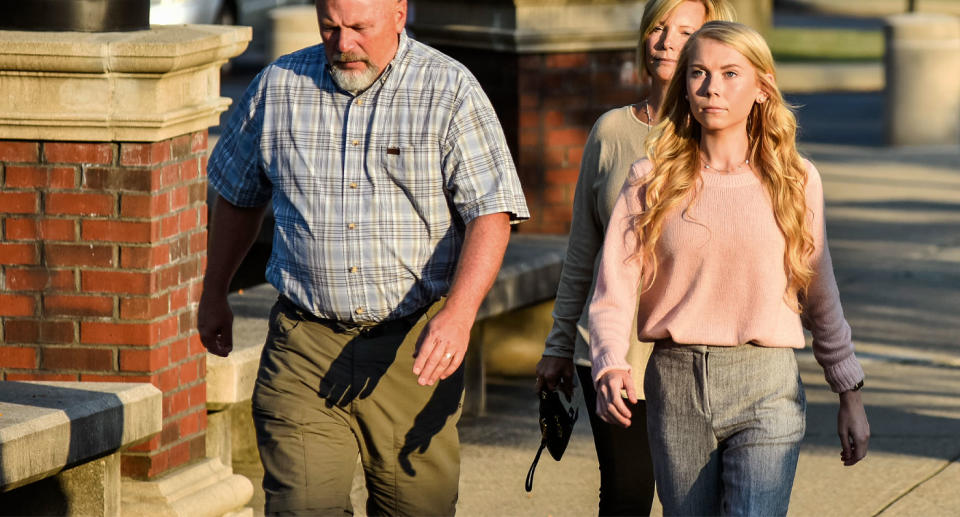 Richardson with parents outside court after reports she partied with friends after being acquitted of murder.