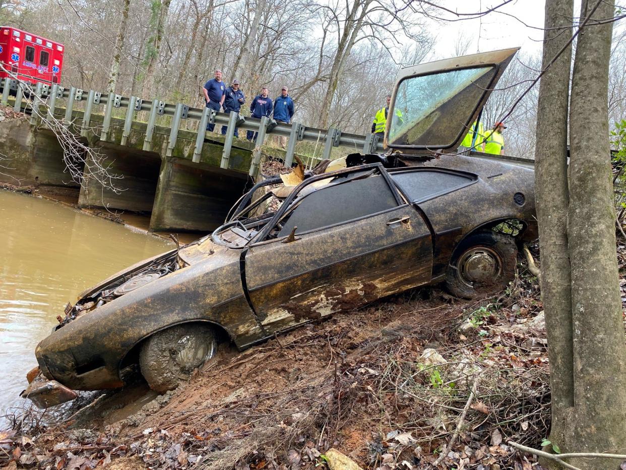 Kyle Clinkscales' Ford Pinto is removed from a creek in Alabama.