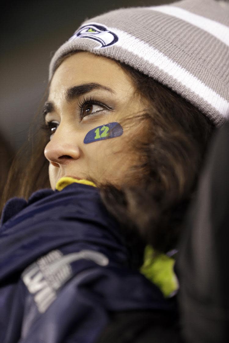 A Seattle Seahawks fan watches the NFL Super Bowl XLVIII football game between the Seattle Seahawks and the Denver Broncos Sunday, Feb. 2, 2014, in East Rutherford, N.J. (AP Photo/Seth Wenig)