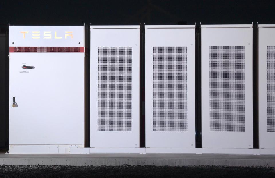 TeslaÂ Inc. Powerpacks that will be used to form theÂ world's largestÂ lithium-ionÂ battery stand on display at the Hornsdale wind farm, operated by Neoen SAS, near Jamestown, South Australia, on Friday, Sept. 29, 2017.Â Against a backdrop of wind turbines 150 miles (241 kilometers) north of Adelaide, Tesla Chief Executive Officer Elon Musk announced a contract to build theÂ world's largestÂ lithium-ion battery system had been signed with South Australia's power distributor, triggering a 100-day self-imposed deadline to install the electricity storage system. Photographer: Carla Gottgens/Bloomberg via Getty Images