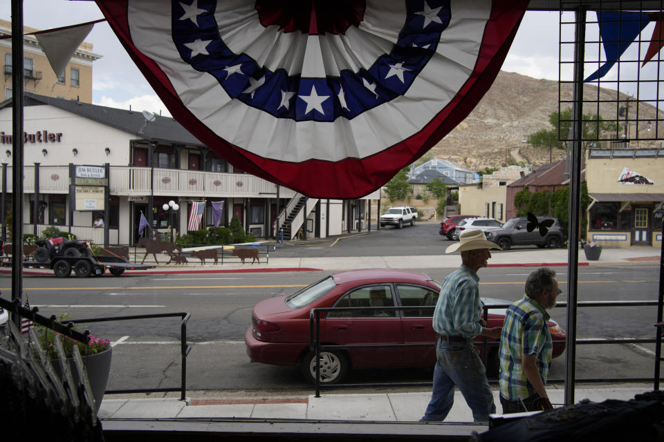 FILE - People walk along the main drag in the county seat of Nye County on July 18, 2022, in Tonopah, Nev. Nevada voters on Tuesday, Nov. 8, 2022, decided to adopt what is widely considered the most comprehensive state version of the Equal Rights Amendment, a sweeping update that could put protections in place for people who have historically been marginalized in the state Constitution. (AP Photo/John Locher, File)