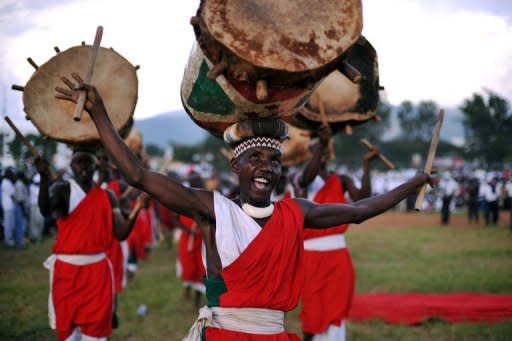 A traditional Burundian drummer performs at a political rally in Bujumbura. Burundi plans visiting royalty, marching bands and fireworks to mark 50 years of independence from Belgium, though in neighbouring Rwanda the ceremonies have a more sombre tone