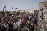 Mourners carry the coffin of slain Al Jazeera veteran journalist Shireen Abu Akleh during her funeral in Jerusalem, Friday, May 13, 2022. Abu Akleh, a Palestinian-American reporter who covered the Mideast conflict for more than 25 years, was shot dead Wednesday during an Israeli military raid in the West Bank town of Jenin. (AP Photo/Mahmoud Illean)