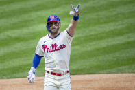 Philadelphia Phillies' Bryce Harper (3) gestures after crossing the plate on a home run during the first inning of a baseball game against the St. Louis Cardinals, Sunday, April 18, 2021, in Philadelphia. (AP Photo/Laurence Kesterson)