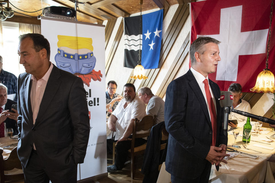 SVP President and State Councillor Marco Chiesa, TI, on the right, and National Councillor Thomas Matter, BL, speak about the limitation initiative on Sunday, 27 September 2020 in Rothrist, Switzerland. The Swiss electorate has to decide on five Swiss proposals (Peter Schneider/Keystone via AP)