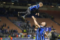Inter Milan's Danilo D'Ambrosio celebrates with his son at the end of the Champions League semifinal second leg soccer match between Inter Milan and AC Milan at the San Siro stadium in Milan, Italy, Tuesday, May 16, 2023. (AP Photo/Luca Bruno)