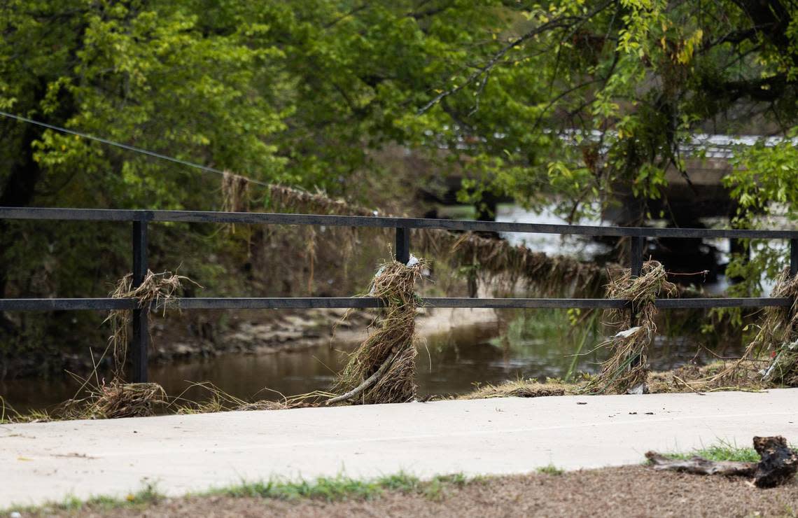 Debris collected along the railings at Little Fossil Creek on Tuesday, Aug. 23, 2022, in Haltom City. The area flooded after it rained more than 9 inches.