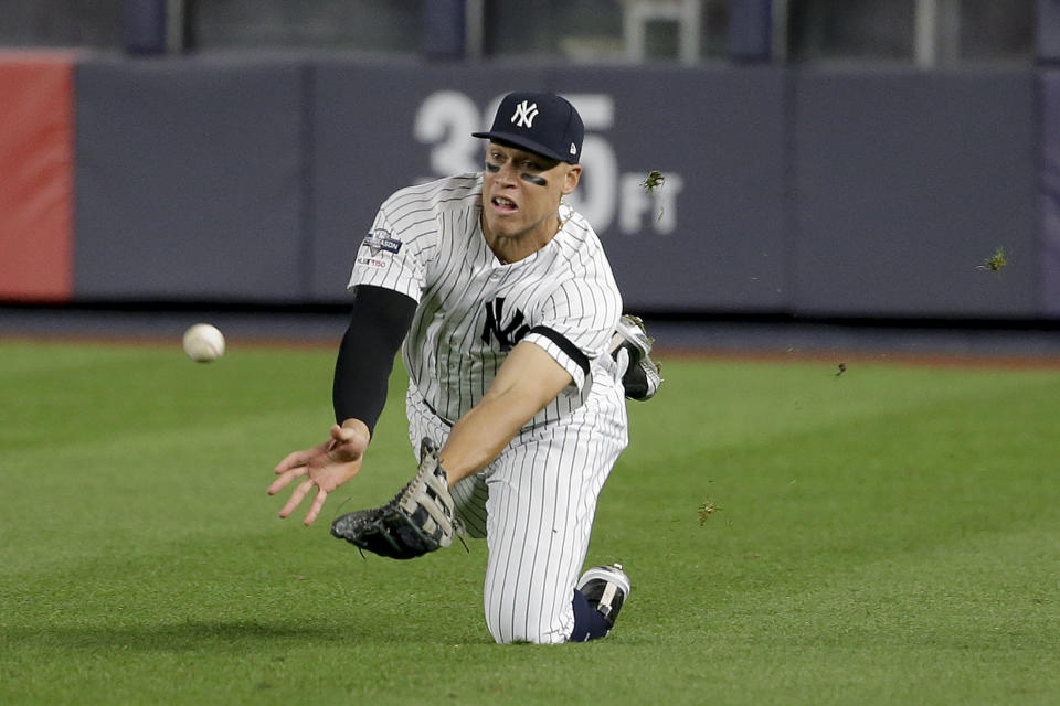 New York Yankees right fielder Aaron Judge makes a diving catch on a ball hit by Minnesota Twins' Jorge Polanco during the third inning of Game 1 of an American League Division Series baseball game, Friday, Oct. 4, 2019, in New York.(AP Photo/Seth Wenig)