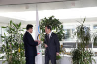 North Korea's Olympic Committee President and Minister of Physical Culture and Sports Kim Il Guk and South Korean Sports Minister Do Jong-hwan, talk during a working meeting to discuss further sports cooperation between the Republic of Korea (ROK) and the Democratic People’s Republic of Korea (DPRK) as well as their bid to co-host the 2032 Summer Olympics, at the IOC Headquarters in Lausanne, Switzerland, February 15, 2019. Salvatore Di Nolfi/Pool via REUTERS