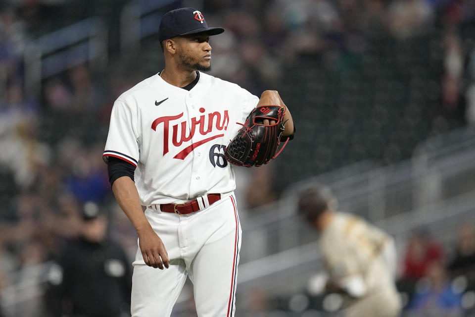 Minnesota Twins relief pitcher Jorge Alcala reacts after a three-run home run by San Diego Padres' Manny Machado during the ninth inning of a baseball game Tuesday, May 9, 2023, in Minneapolis. (AP Photo/Abbie Parr)