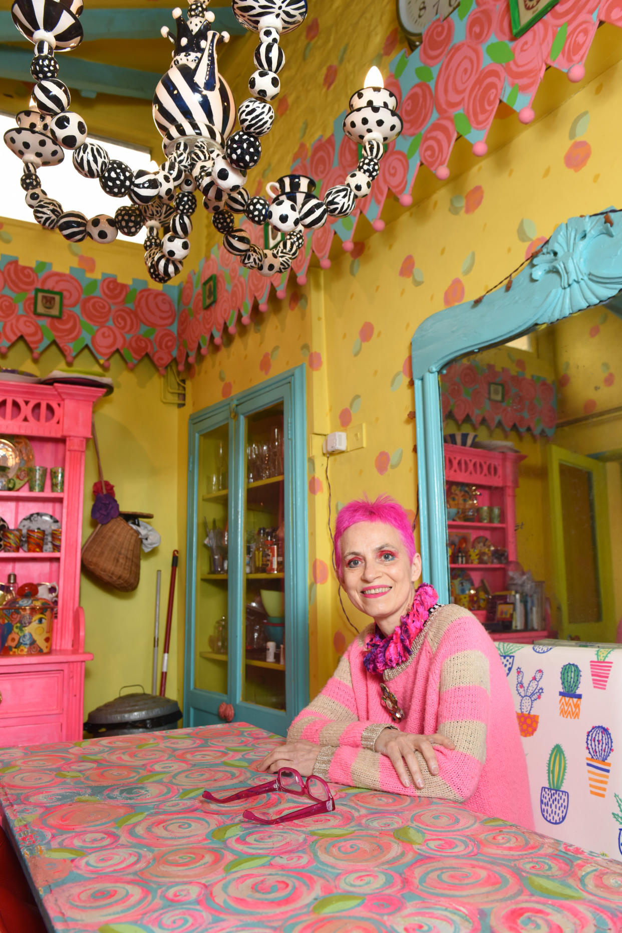 PIC BY MERCURY PRESS (PICTURED Potter, Mary Rose Young, 61 has made her Â£500,000 home unsellable with her eccentric, colourful decor) A woman who spent more than 30 years turning her rundown cottage into a life-size doll house says her colourful decoration has made the house - which should be worth upwards of half a million pounds - unsellable.  Potter, Mary Rose Young, 61, has been painting the beautiful country cottage in leafy Lydney, Gloucs in her electric style by hand since 1987, when she bought the former squatterâs house for just Â£30,000. After 27 years in the house, she put it on the market in 2014, where estate agents said the property should have been expected to fetch at least Â£500,000. But despite hoping to sell the property to open a B&B nearby, estate agents could only persuade one person to view the house - leaving the family stuck there. SEE MERCURY COPY