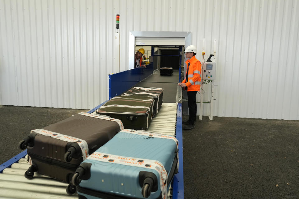 The "baggage factory", where athletes' luggages for the Paris 2024 Olympic Games will be collected, are seen in Charles de Gaulle airport, in Roissy-en-France, north of Paris, Tuesday, April 23, 2024 in Paris. (AP Photo/Thibault Camus)