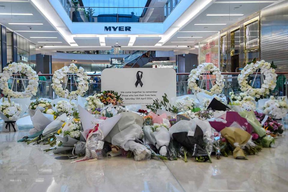 <p>AYUSH KUMAR/AFP via Getty Images</p> Floral memorial set up inside the Bondi Junction Westfield Shopping Centre.