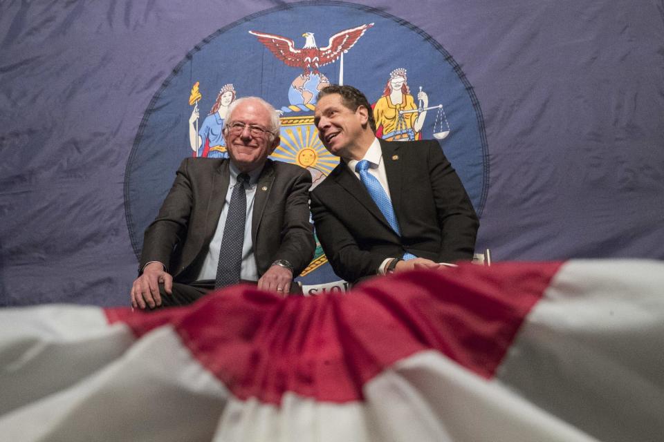 FILE- In this Jan. 3, 2017, file photo, New York Gov. Andrew Cuomo, right, and Vermont Sen. Bernie Sanders appear onstage together during an event at LaGuardia Community College in New York. Leading Democrats around the country are struggling to respond following Trump's victory in November. Cuomo has been mentioned on some lists as a possible challenger in 2020. That speculation only intensified when Cuomo asked Sanders to join him in announcing his free-tuition plan, which would cover students attending public institutions whose families make $125,000 or less. (AP Photo/Mary Altaffer, File)