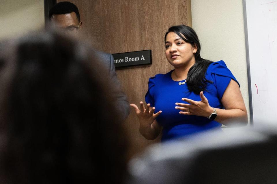 Kishwer Vikaas, with the American Immigration Lawyers Association, discusses the U Visa for victims of criminal activity in Sacramento on June 3 to a group of immigrants that arrived in the city last year.