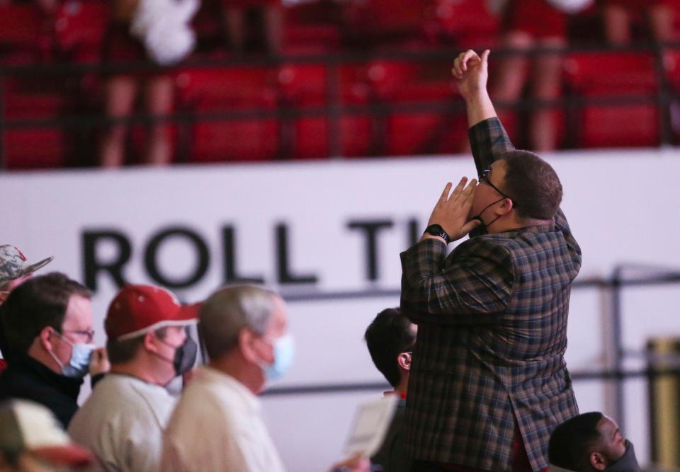 Luke Ratliff leads the cheers in the student seating area as the Crimson Tide hosts Vandy on Feb. 20 in Coleman Coliseum in Tuscaloosa, Ala.