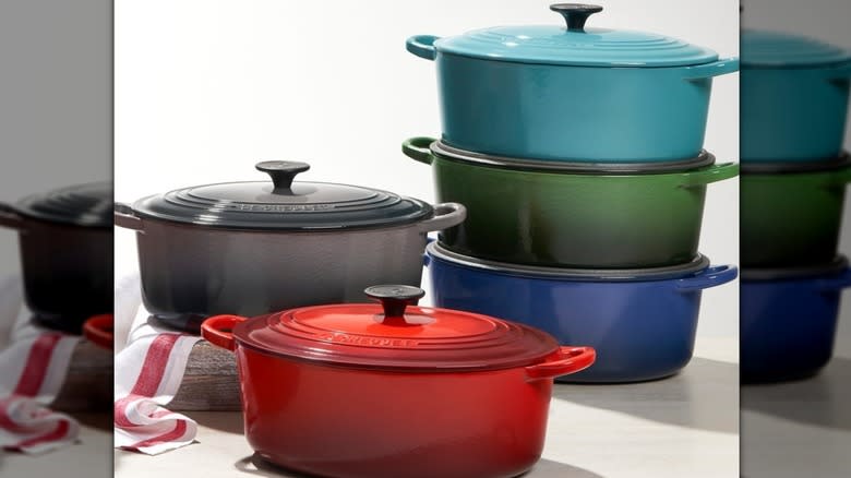 Several colorful Le Creuset casserole dishes