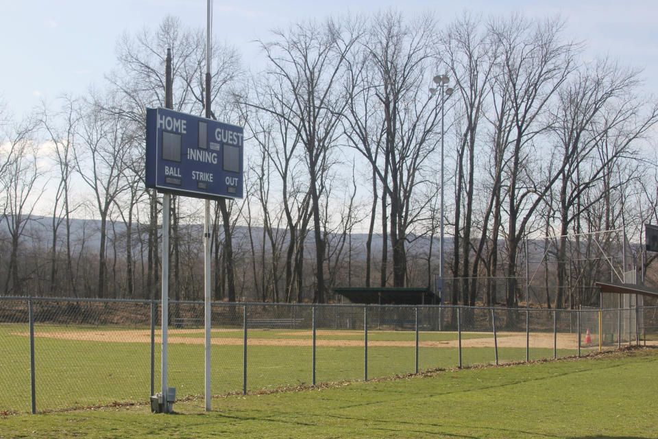 An empty Little League baseball field is shown in Washingtonville, N.Y., Wednesday, April 1, 2020. Mike DeLuca envisioned his youngest son, John, capping his baseball career the same way most 12-year-old All-Star squads from Monroeville, Pennsylvania, had for the last two decades: with a week spent playing teams from all over the country at Cooperstown Dreams Park in early August. Then the COVID-19 pandemic arrived in the United States and the shutdowns began. (AP Photo/Paul Kazdan)